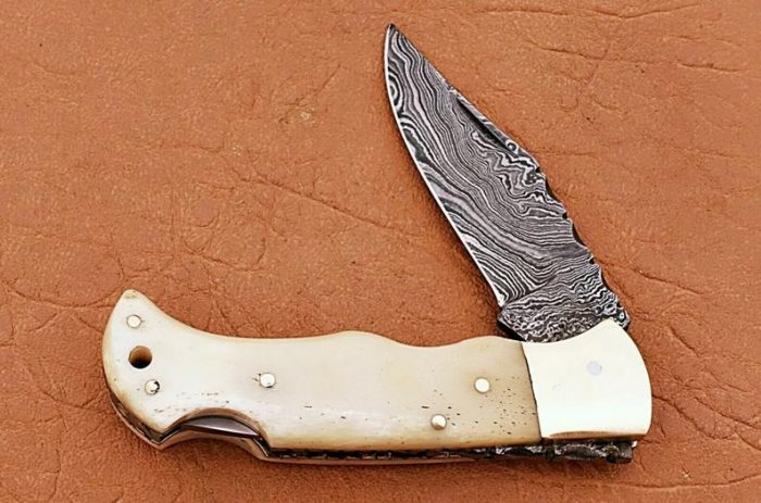 Hand Forged Pocket knife In Damascus With Leather Sheath